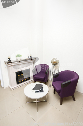 Image of Lounge area with chairs and fireplace