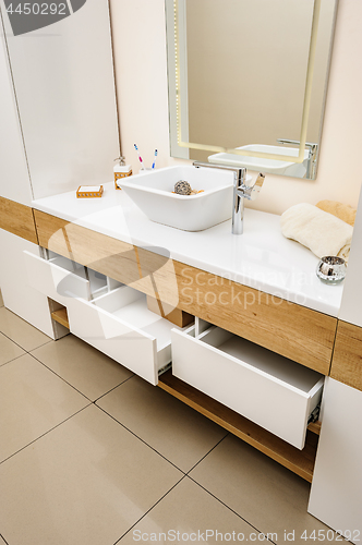 Image of Bathroom interior detail with sink and faucet