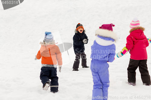 Image of happy little kids playing outdoors in winter