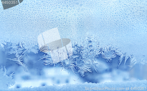 Image of Ice pattern and frozen water drops on glass