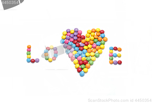 Image of Word ''Love'' and abstract heart from bright colorful candy