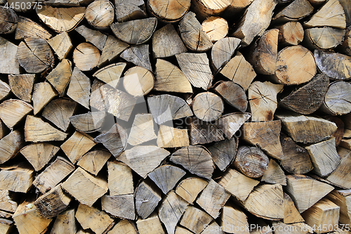 Image of Firewood pile stacked chopped wood trunks