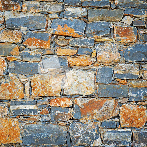 Image of Part of grunge colorful stone blocks wall.