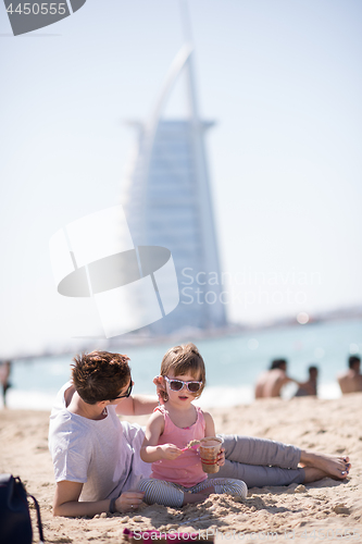 Image of Mom and daughter on the beach