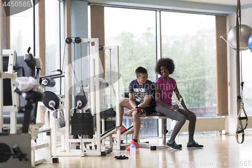 Image of couple in a gym have break