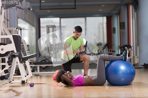 Image of pilates  workout with personal trainer at gym
