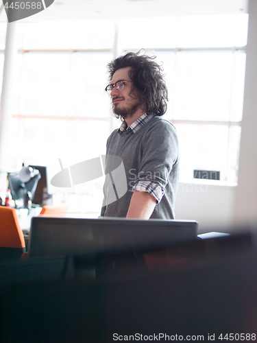 Image of young businessman in startup office