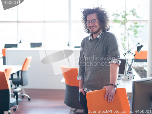 Image of young businessman in startup office