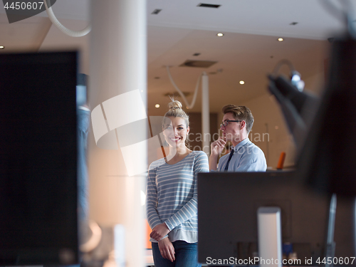 Image of startup business couple in a modern office