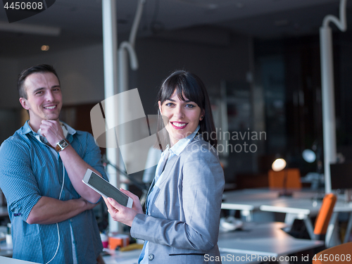 Image of Business People Working With Tablet in office