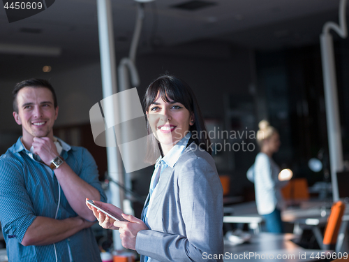 Image of Business People Working With Tablet in office