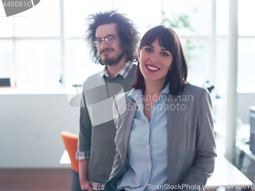 Image of startup business couple in a modern office