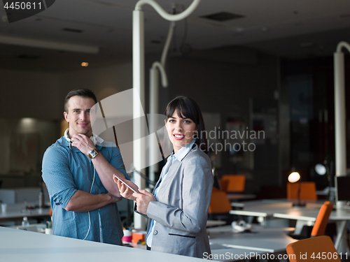 Image of Business People Working With Tablet in office