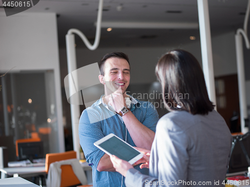 Image of Business People Working With Tablet in office