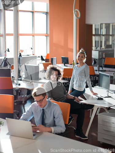 Image of businessman working using a laptop in startup office