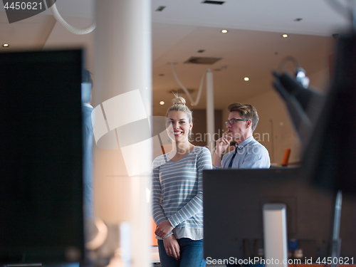 Image of startup business couple in a modern office