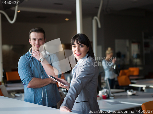 Image of Business People Working With Tablet in office