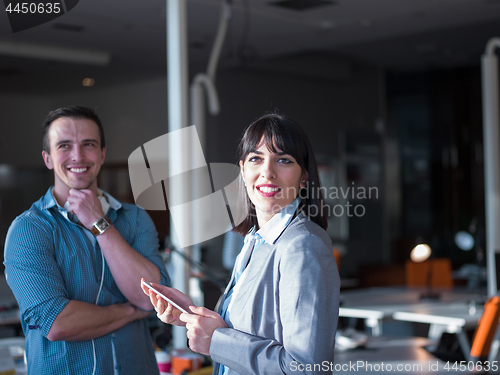 Image of Business People Working With Tablet in office