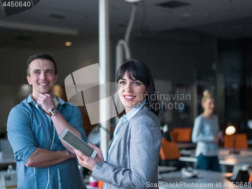 Image of Business People Working With Tablet in office