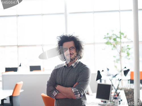 Image of young businessman in startup office