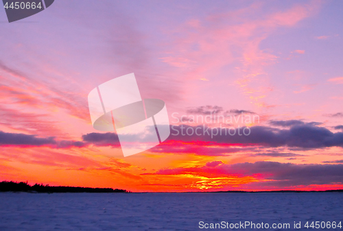 Image of Winter sunset over frozen Baltic Sea in Finland