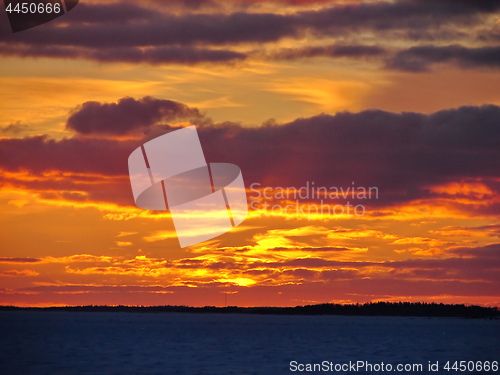 Image of Winter sunset over frozen Baltic Sea in Finland