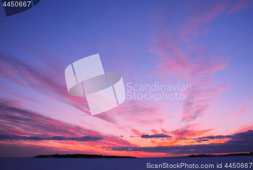 Image of Winter sunset over frozen Baltic Sea in Finland