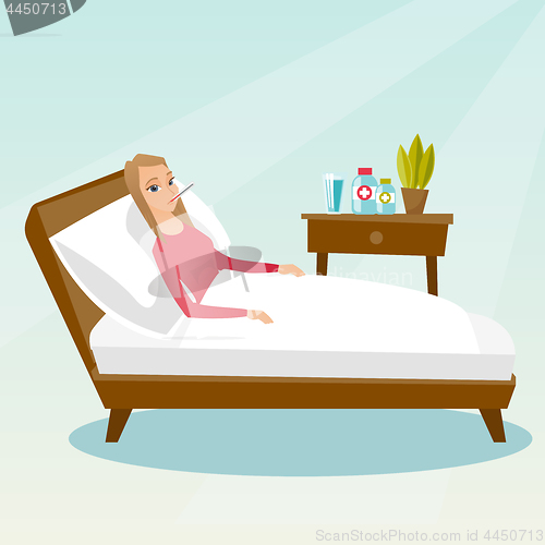 Image of Sick woman with thermometer laying in bed.