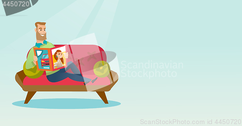 Image of Man reading a magazine on the couch.