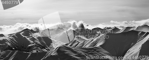 Image of Black and white panorama of evening snow mountains
