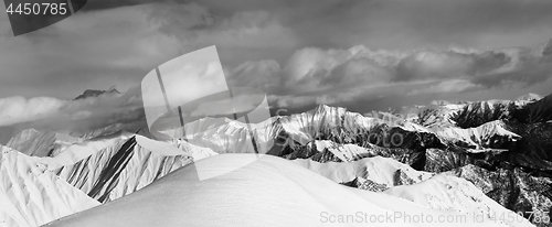 Image of Black and white panoramic view on off-piste snow slope and cloud