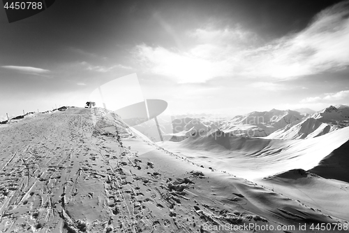 Image of Black and white view on top station of ropeway in sun winter eve