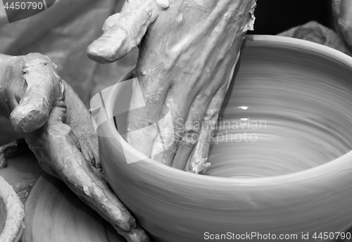 Image of Process of making clay bowl on pottery wheel