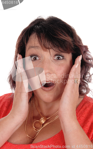 Image of Surprised woman with hands on face