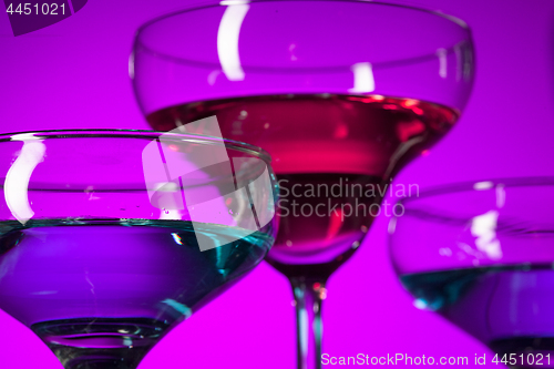 Image of Three wine glasses standing on the table at studio