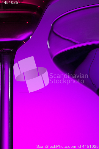 Image of Two wine glasses standing on the table at studio