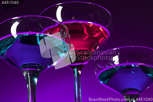 Image of Three wine glasses standing on the table at studio