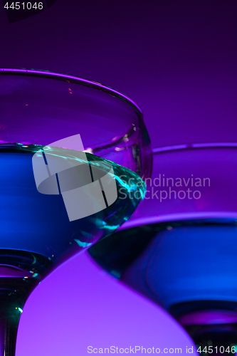 Image of Two wine glasses standing on the table at studio