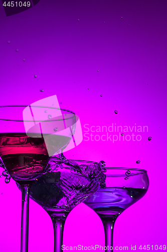Image of Three wine glasses standing on the table at studio