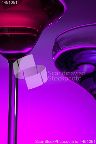 Image of Two wine glasses standing on the table at studio