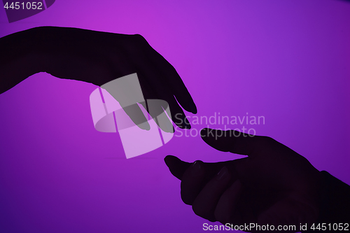 Image of Male and female hands are drawn to each other. concept of care, support, love. toned