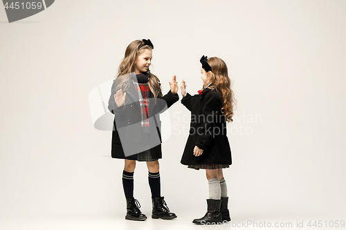 Image of The fashion portrait of young beautiful teen girls at studio