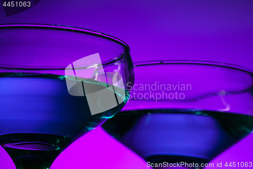 Image of Two wine glasses standing on the table at studio