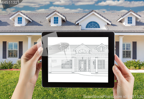 Image of Female Hands Holding Computer Tablet with House Drawing on Scree