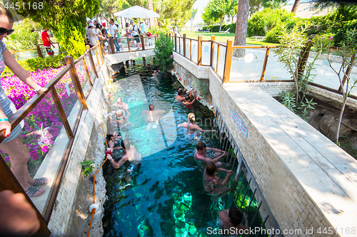 Image of Tourists swim in antique Cleopatra pool