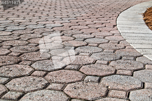 Image of low angle close up of brick paver driveway