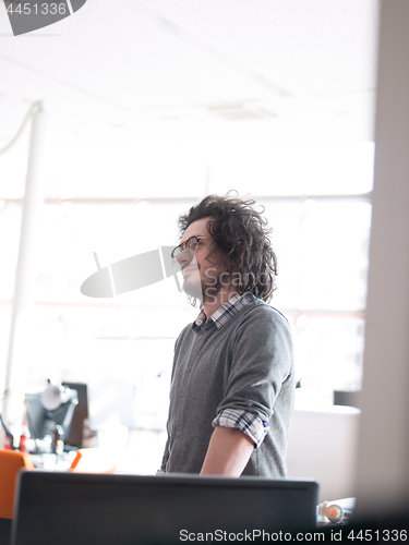 Image of young businessman in startup office