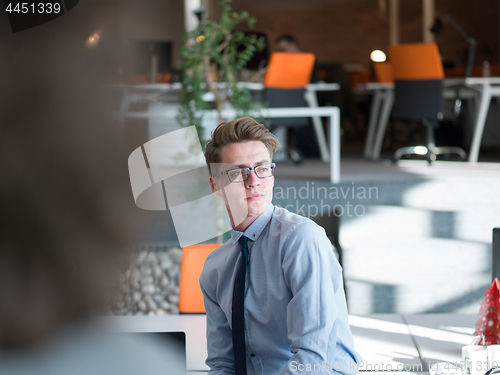 Image of young businessman in startup office