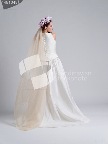 Image of Rear view of a beautiful young woman in a wedding dress