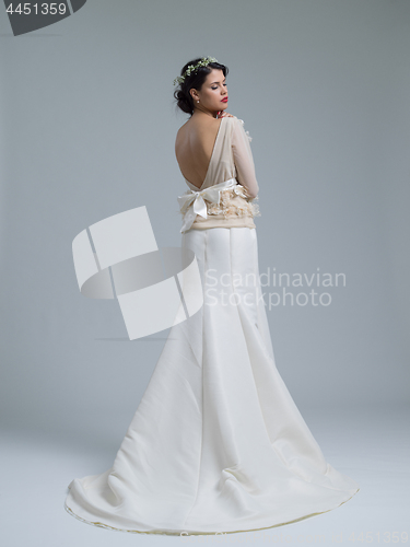 Image of Rear view of a beautiful young woman in a wedding dress